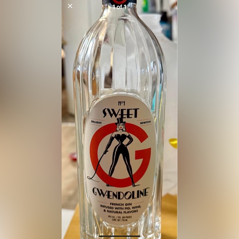Empty Sweet Gwendolyn bottle. Dita Von Teese. Dominatrix graphics.